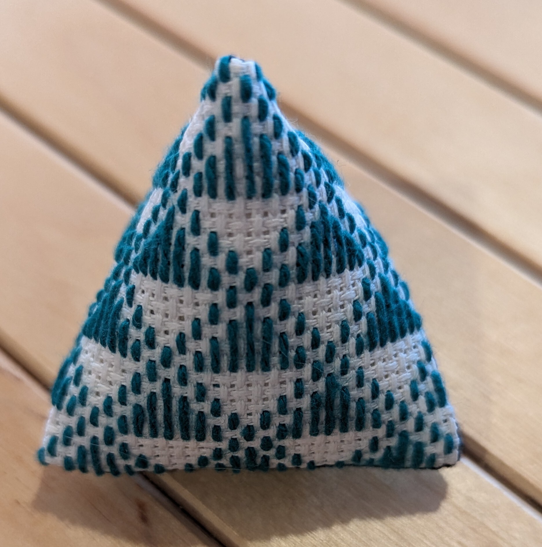 and then you sew it into a little pyramid ahape