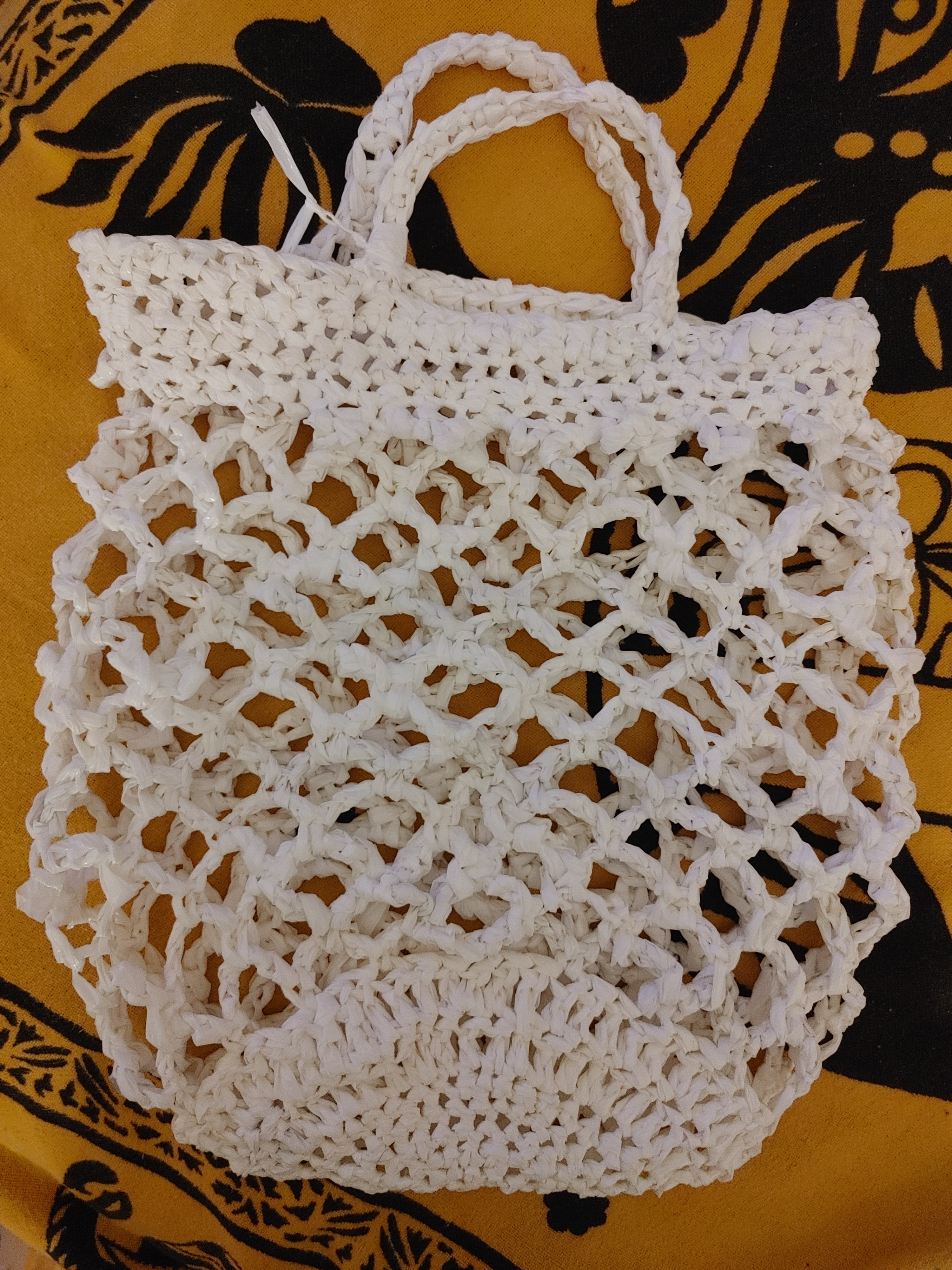 Crochet mesh bag made from white plastic bags